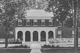 Black and white photo of a green mansion in Brandon, Vermont owned by Shirley Farr during the years she funded the Vermont Eugenics Survey.