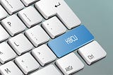 White lettered HBCU written on a light blue keyboard button.