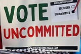 A sign with ‘Vote Uncommitted’ in big print.