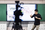 Teacher in China teaching recorded class