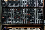 Where did synthesizers in music come from?