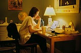 Student studying at night with laptop and planner — productivity tools, student planners, and dorm desk setup inspiration.