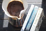 Chemex coffee maker and three books (Folk of the Air series)