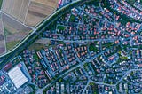 Ariel photo of suburban grids edging farmlands