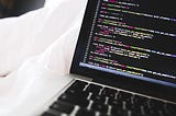 A image of a computer with some programming code