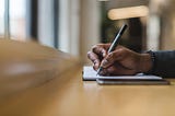 Handwriting in notebook or notepad. Fiction writing sprint.