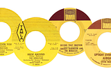 Four yellow labeled 45 RPM records from Tamla Records