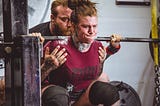 Woman lifting heavy weights.