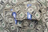 Piles of dollar bills.