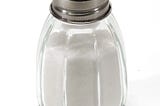 Salt shaker against white background