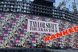 massive digital screen backdrop for a concert displaying pre-show image of a multicolored photo patchwork, with the large words “Taylor Swift: The Eras Tour” at center; the word “RANKED” is pasted overtop of the photo
