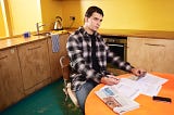 man sitting at table