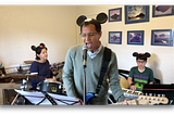 Natasha playing drums, John singing and playing guitar, Eliott playing keyboard.