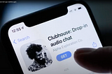 A finger poised over the Clubhouse app on Apple’s App Store.