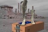 A desert ruin. In the foreground is a huge Amazon box, with an EU flag in place of its shipping label. Atop the box are the feet and partial legs of an Oxymandias figure. Image: Rama (modified) https://commons.wikimedia.org/wiki/File:Gladiator_with_sword-Louis_Ernest_Meissonnier-MG_1216-IMG_1223-white.jpg CC BY-SA 3.0 https://creativecommons.org/licenses/by-sa/3.0/fr/deed.en