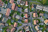 Overhead view of typical British houses in a suburban area, some with solar panels installed