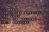 Text on a brick wall reads, “TO MAKE SOMETHING SPECIAL YOU JUST HAVE TO BELIEVE IT’S SPECIAL,” with each word displayed on individual black tiles.