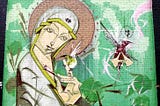 Mural on a brick wall of a smiling Madonna with a hummingbird perched on her finger