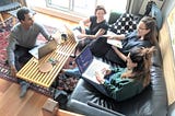 Four people working around a table.