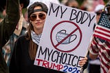 SERGIO FLORES/GETTY photo of an anti-quarantine rally sign