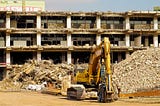 A picture of a bulldozer in a demolition site