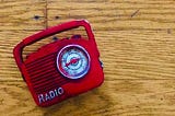 A model of a red vintage radio.