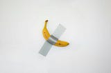 An image of a banana with tape across the middle