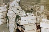 An enlisted Army Master Sergeant is doing inventory in an Army mess area on an Army base at Los Almos, New Mexico during WWII and The Manhattan Project.