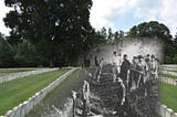 An 1864 photograph of Andersonville Prison Cemeteyr overlayed on a 2015 phtograph of Andersonville National Cemetery