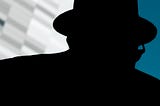 An up close, abstract street photograph of a silhouetted man wearing a hat and glasses disguising his identity.