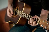 a man playing the guitar