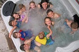 Me with many of my nieces and nephews in April 2006. Nine children (and one neighborhood friend) and none of them mine.