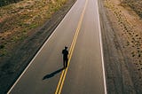 Man Walking on an empty road