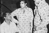 Hrishikesh Mukherjee, Rajesh Khanna, and Amitabh Bachchan captured during the shoot of Namak Haraam.
