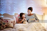 Mom, 5-year-old daughter, bed, storytelling
