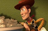 Woody the cowboy sheriff gazing cheerfully at the popcorn