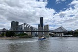 A ferry passing underneath Story Bridge on the Brisbane River.