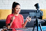 Young lady creating a video about makeup