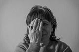 Black and white photo of a woman who is worried
