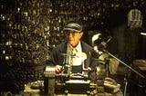 The Keymaker sitting in his office among thousands of keys. From The Matrix.