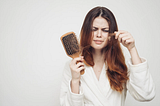 What are the health benefits of Biotin and how does it help to prevent hair loss