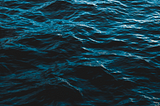 Black and dark navy image of the a small section of the ocean. The image gives a sense of the deepness of the ocean.