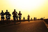 Source: https://www.wallpaperflare.com/people-running-on-road-during-daytime-runners-silhouettes-dusk-wallpaper-whyhx