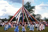 Maypole dance — a tall pole with ribbons hanging from the top with dancers holding the ends and moving around to form complex patterns