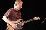 Tom Verlaine playing guitar