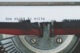 Antique typewriter close up with black and white text