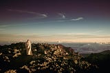 Monk on top of mountain