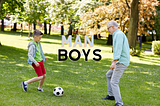 young boy soccer with older man like dad or gr