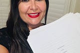 Picture of the author with her book baby.