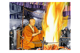 A Buddhist monk in an orange robe performs a traditional Goma fire ritual, seated close to a towering flame inside a temple, as onlookers watch with reverence behind a rope barrier.